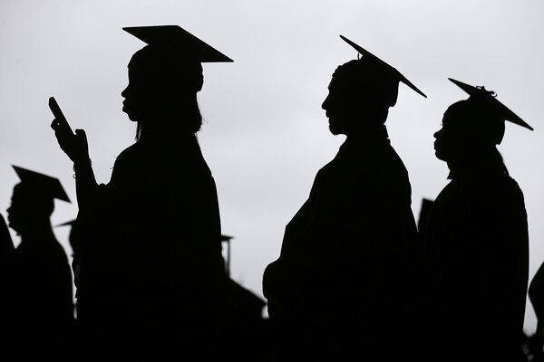 New graduates line up before the Bergen Community College commencement in New Jersey, May 17, 2018. Although some student loan debt has been canceled recently, the federal government is now seeking repayment of delinquent loans.